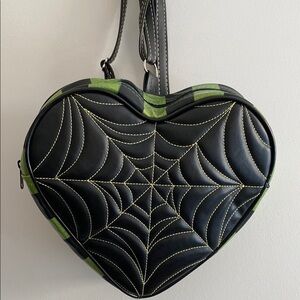 Love, Pain and Stitches Heart-Shaped Black and Green backpack purse